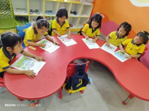 Pre Primary students involved in Tiger Preservation coloring activity.
